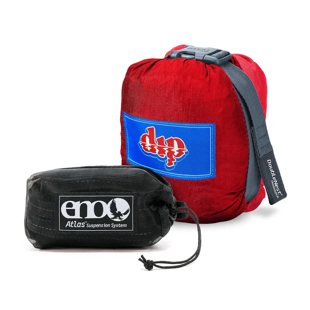 Red hammock bag with blue logo and black stuff sack on a white background